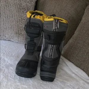 Gently Loved Yellow and Black Snow Boots by Sorel