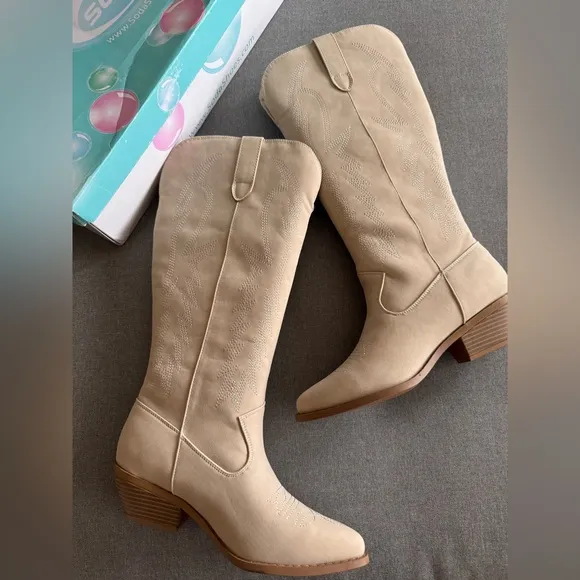 Gorgeous stitched cowboy boots in sand